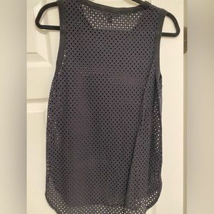 Black mesh-like tank.